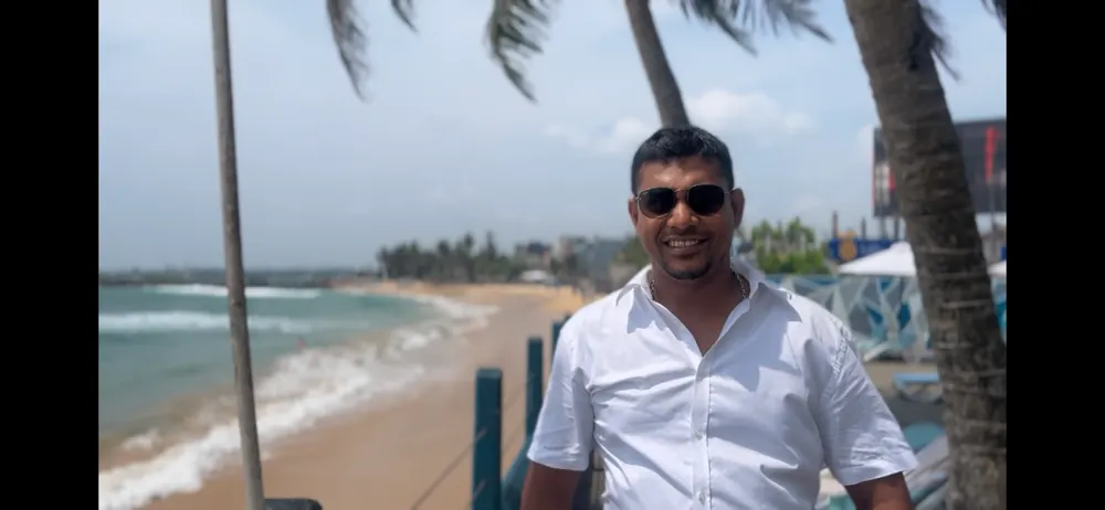 Udul, a licensed local guide, on the beachfront at Hikkaduwa